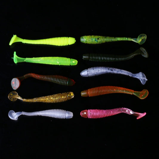 Assorted soft fishing lure worms in multiple colors on black background