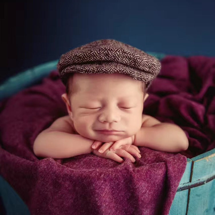 Newborn cabbie hat and bowtie set, brown tweed cap on a sleeping baby