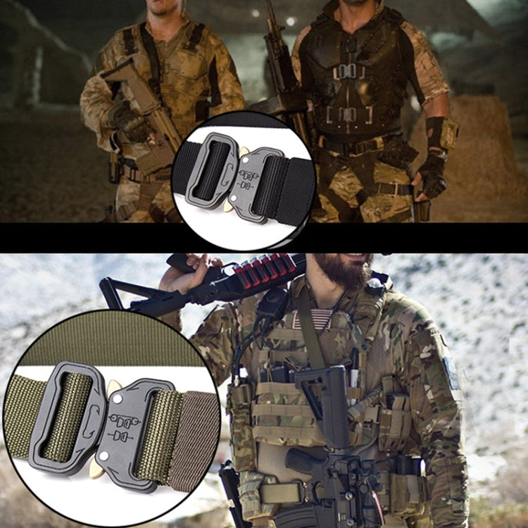 Black quick-release belt buckle close-up with woven strap and double slots