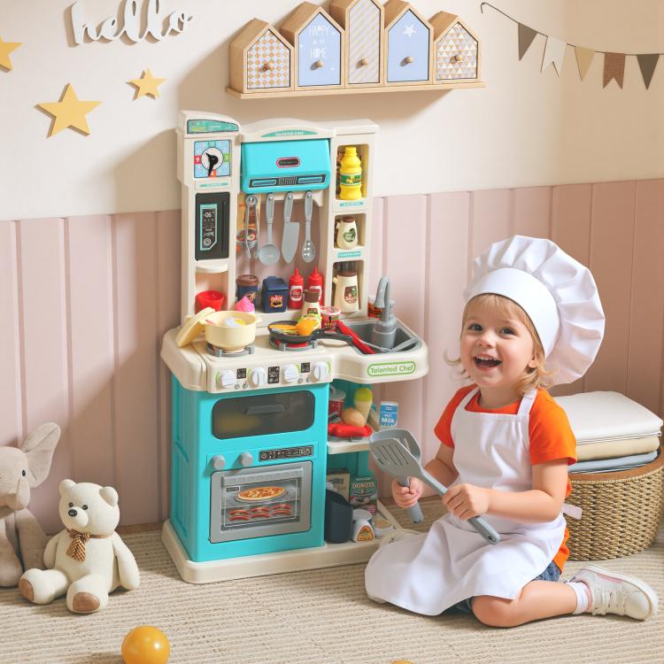 Kids play kitchen toy set with accessories, plus a child wearing a chef hat
