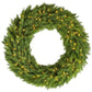 Green artificial Christmas wreath with glowing LED lights, close-up