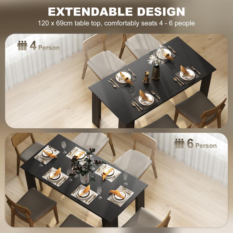 Rectangular dining table with black top and seating setup for multiple guests