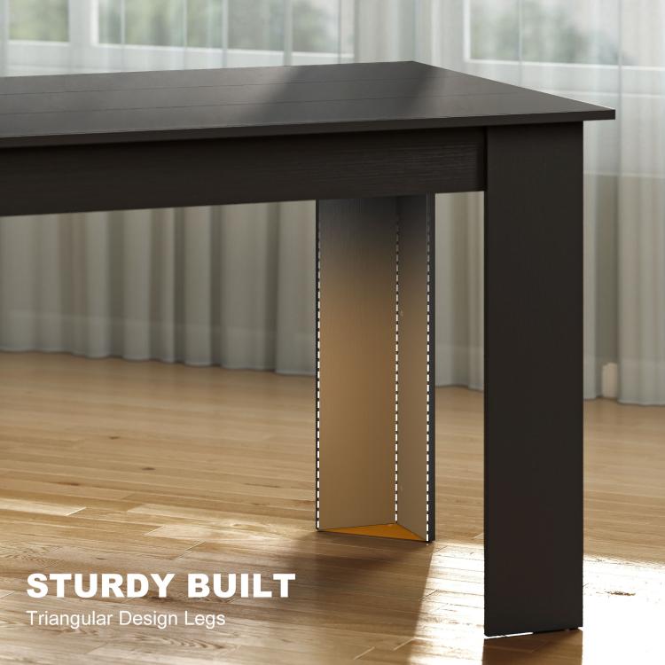 Triangular brace detail on the underside leg support of a dark dining table