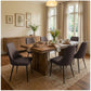 Brown high-back upholstered dining chairs with slim metal legs, arranged around a table