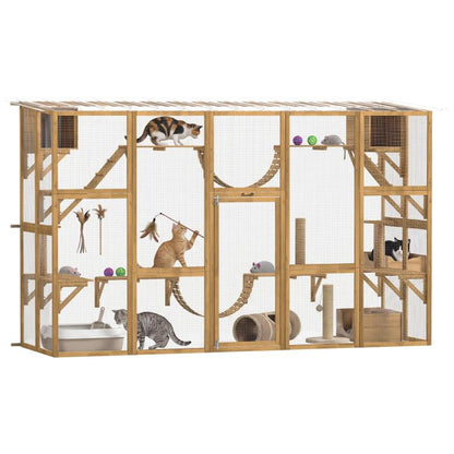 Wooden outdoor cat enclosure with mesh panels, shelves, and rope bridges; cats inside.