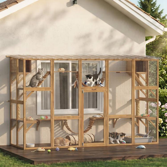 Outdoor wooden cat enclosure with multiple levels, rope bridges, and mesh viewing panels; cats.