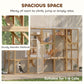 Spacious wooden outdoor cat enclosure with large entry door, resting areas, and mesh walls.