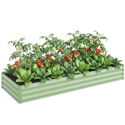 Light green galvanized raised garden bed with leafy greens and red tomatoes