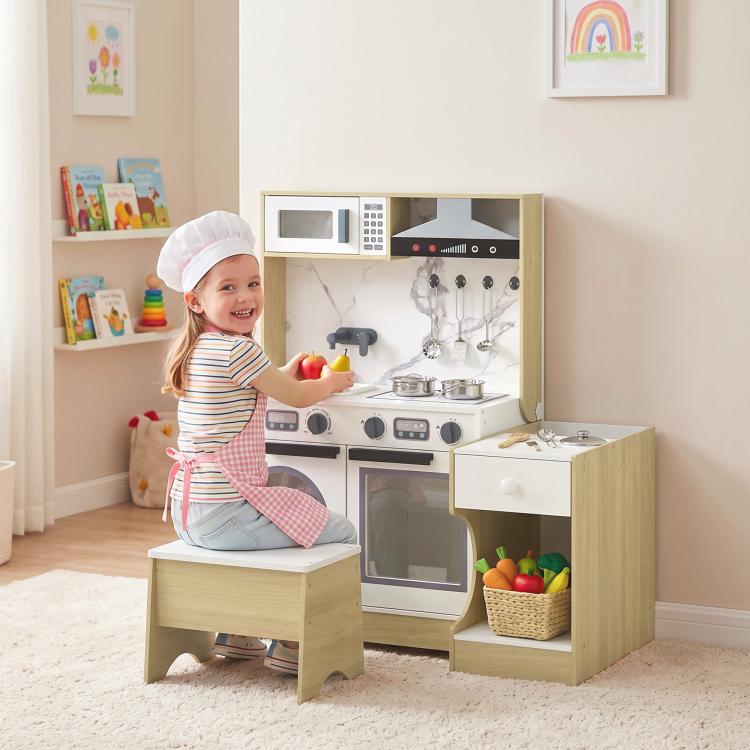Convertible kids kitchen table with sink and stove, plus oven door and storage cubby
