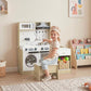 Kids play kitchen set with oven door, sink, hanging utensils, and pull-out drawer