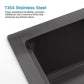 Black kitchen sink basin with sloped rim and brushed stainless steel texture