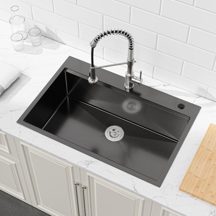 Black single-bowl kitchen sink with round drain and faucet holes, overmount style