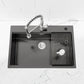 Black overmount single-bowl sink with ridged drying rack on one side
