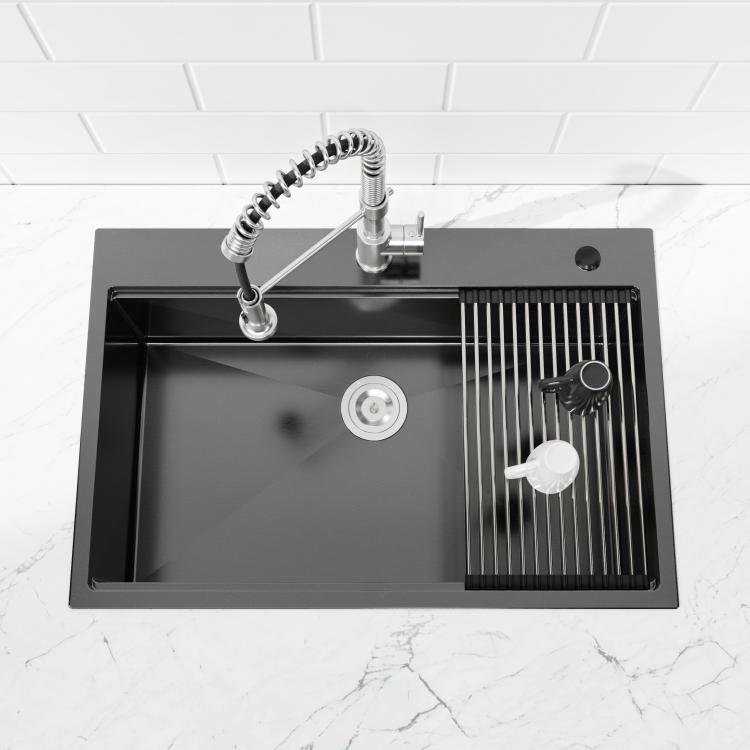 Black overmount single-bowl sink with ridged drying rack on one side