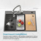 Black sink with built-in drying rack, removable insert tray, and wood cutting board