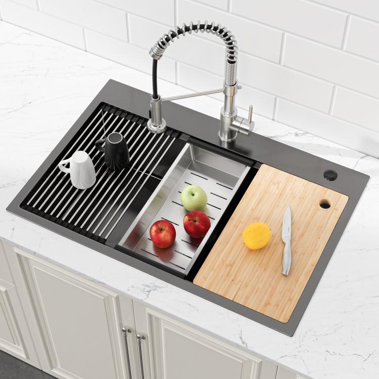 Black overmount sink with faucet, drying rack insert, and wood cutting board