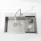 Single-bowl stainless kitchen sink with dark gray basin, faucet, and colander rack