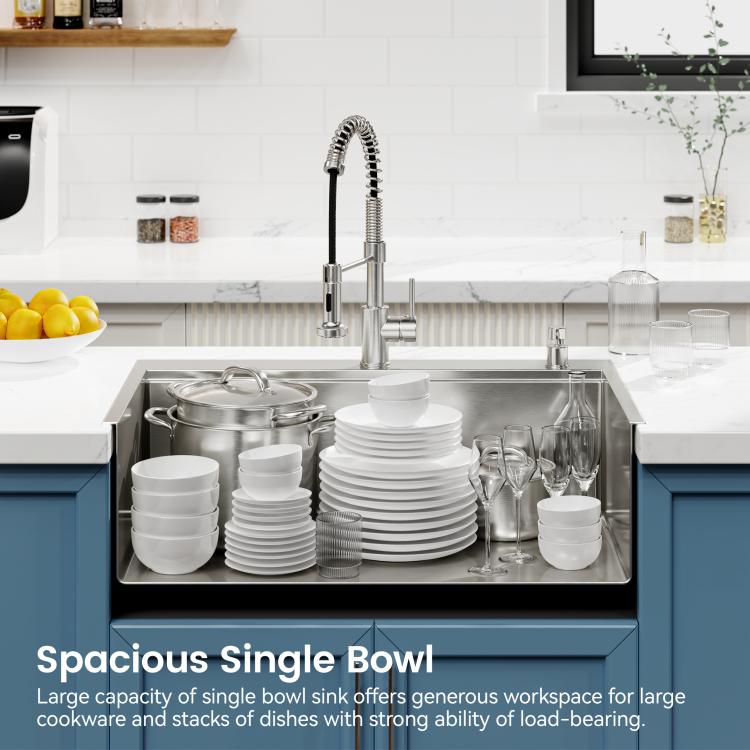 Single-bowl kitchen sink with stacks of dishes and cookware on the drying rack