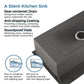 Black double-bowl kitchen sink with rounded corners and two rear drain openings