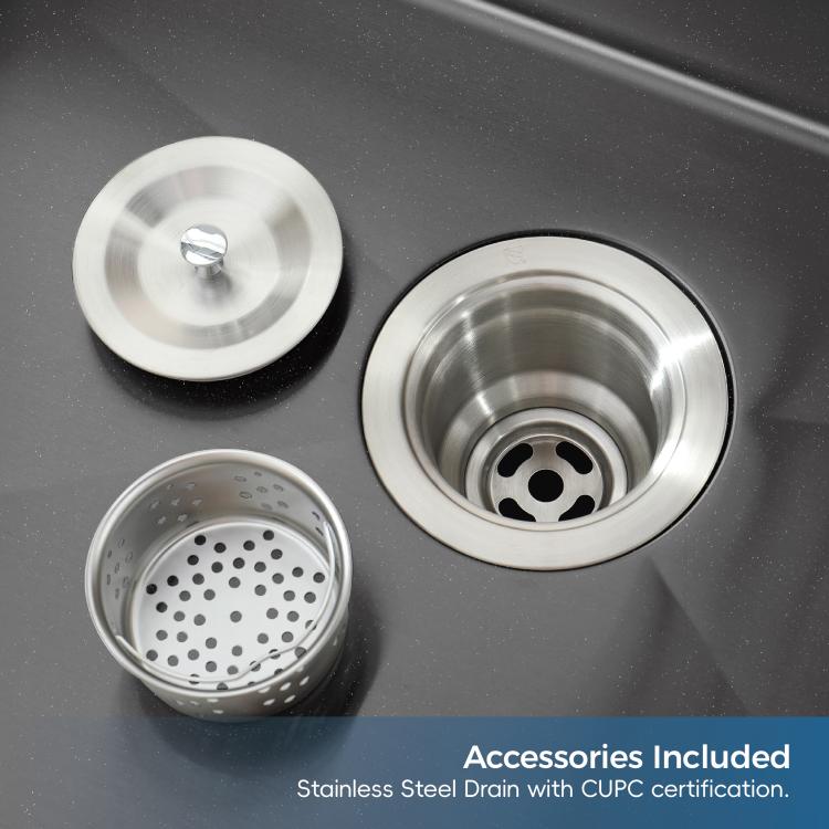 Close-up of black double-bowl sink drains with stainless steel strainers