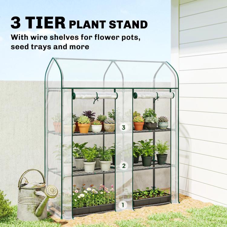 Clear 3-tier plant greenhouse with green frame and three wire shelf levels