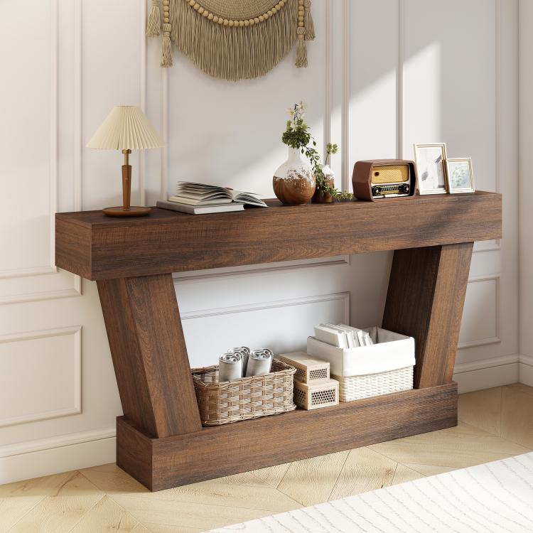 Vintage brown console table featuring top surface and open storage shelf