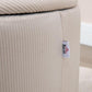 Close-up of cream white corduroy ottoman side seam with fabric label