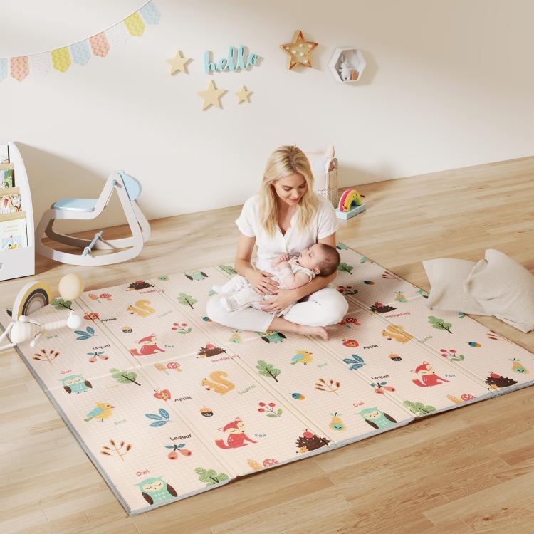 Baby play mat laid on floor, pastel woodland animal pattern with foldable edge panels