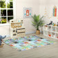Double-sided baby play mat on room floor, colorful alphabet and animal print