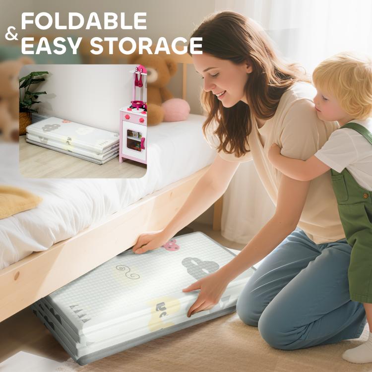 Foldable reversible baby play mat stacked for easy storage, light gray print