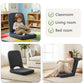 Grey floor chair with padded backrest and seat for comfortable lounging