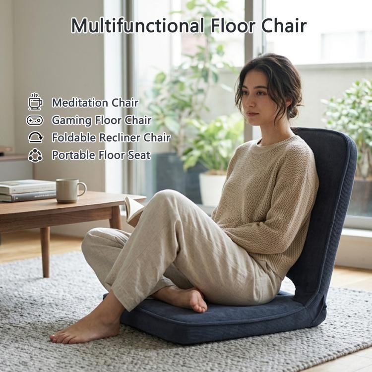 Grey padded floor chair with contoured backrest and seat for reading or gaming