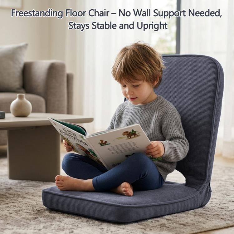 Grey floor chair with tall padded backrest and cushioned seat for kids to read