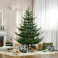 Green artificial Christmas pine tree on a black metal stand, undecorated