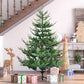 Green artificial Christmas pine tree with hinged branches on a black metal stand