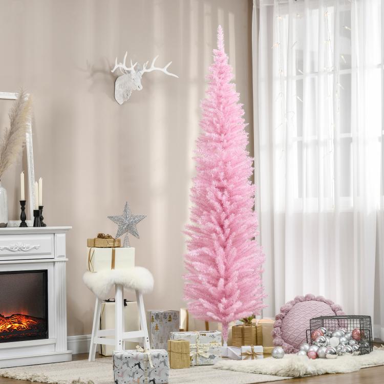 Tall pink artificial Christmas tree standing on a white star base, unlit