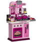 Kids play kitchen toy with pink oven, stovetop burners, and accessory food set