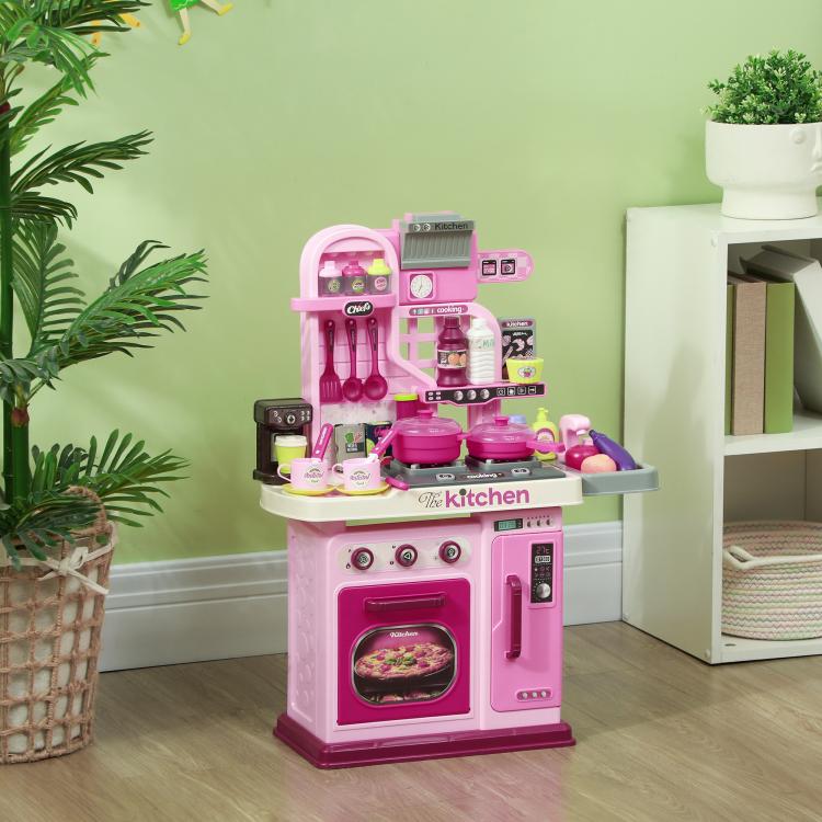 Pink and gray kids pretend kitchen with stove top, oven window and accessory compartments