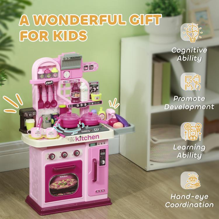 Pink kids play kitchen toy with oven window, stove knobs and full accessory display