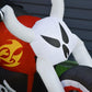 Inflatable white ghost biker yard decoration with black face, holding handlebars