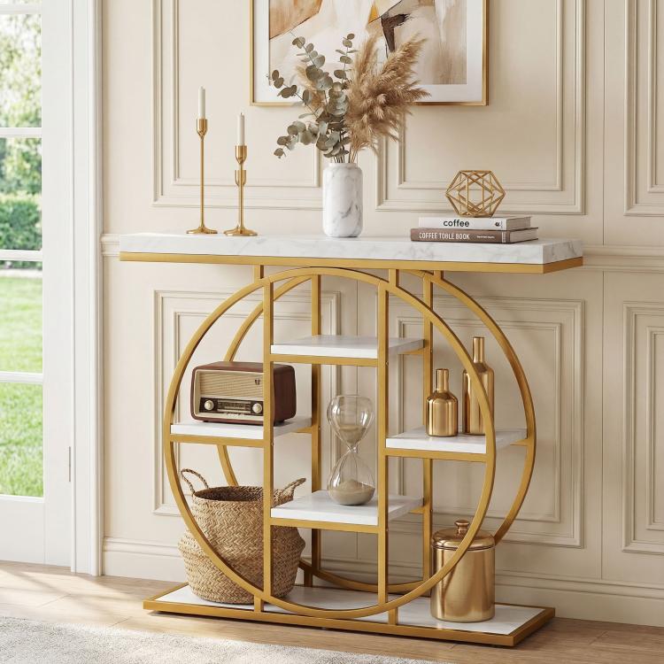 Marble-effect console table with circular gold frame, open shelves, and marble top