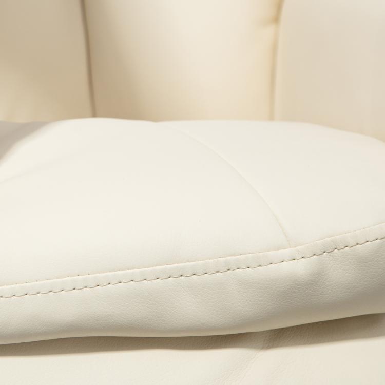 Cream PU recliner armrest and seat cushion with visible seam stitching