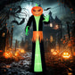 Inflatable pumpkin-head ghost figure with green hands, black body, and orange jagged hem