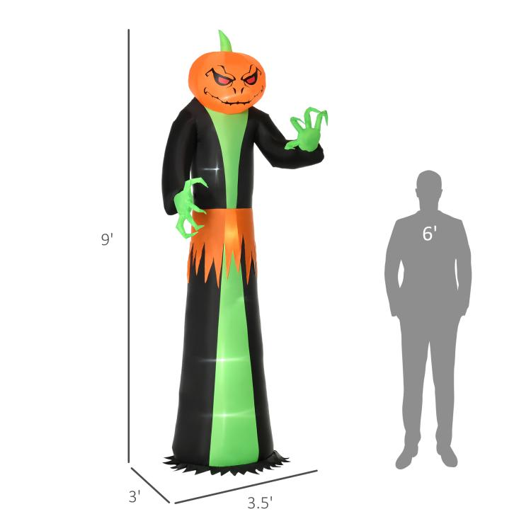 9 ft inflatable pumpkin-head ghost with green hands; shown next to person silhouette