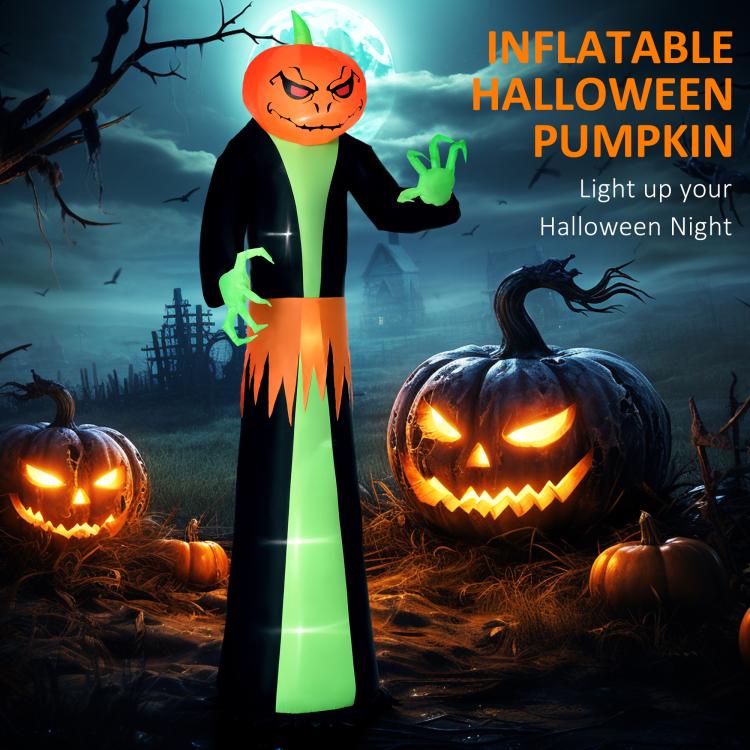 Inflatable pumpkin-head ghost with green hands and orange jack-o’-lantern face, standing