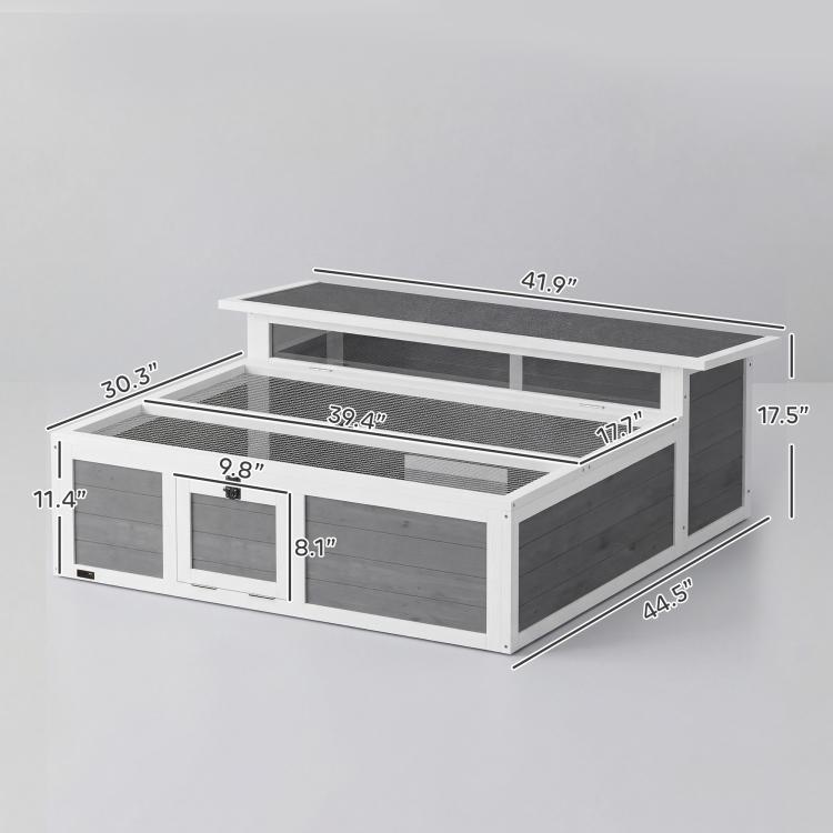 Wooden tortoise enclosure with dark gray wood panels, mesh interior, and front access doors