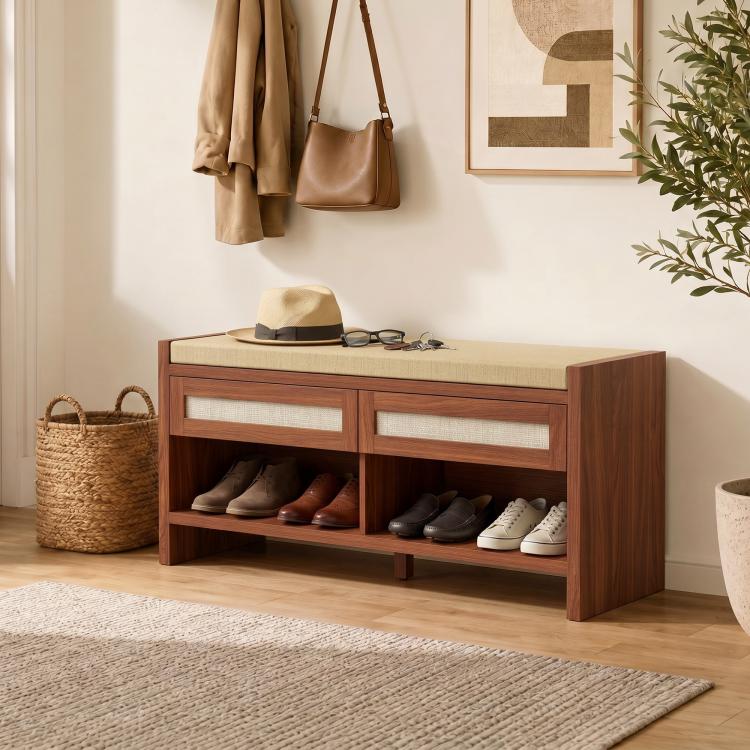 Brown shoe bench with cushioned seat, open shelf, and two rattan drawer doors