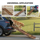 Brown dog ramp with yellow non-slip strips extended from a vehicle toward the yard