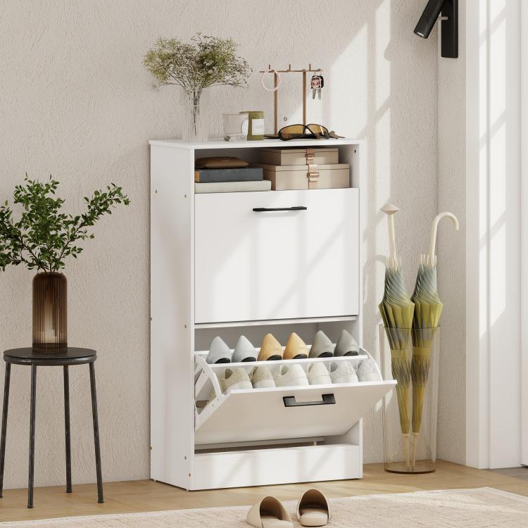 White shoe cabinet with open top shelf and bottom flip drawer holding shoes