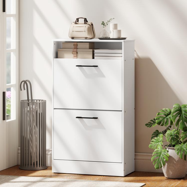 White shoe cabinet with two stacked doors and black pull handles